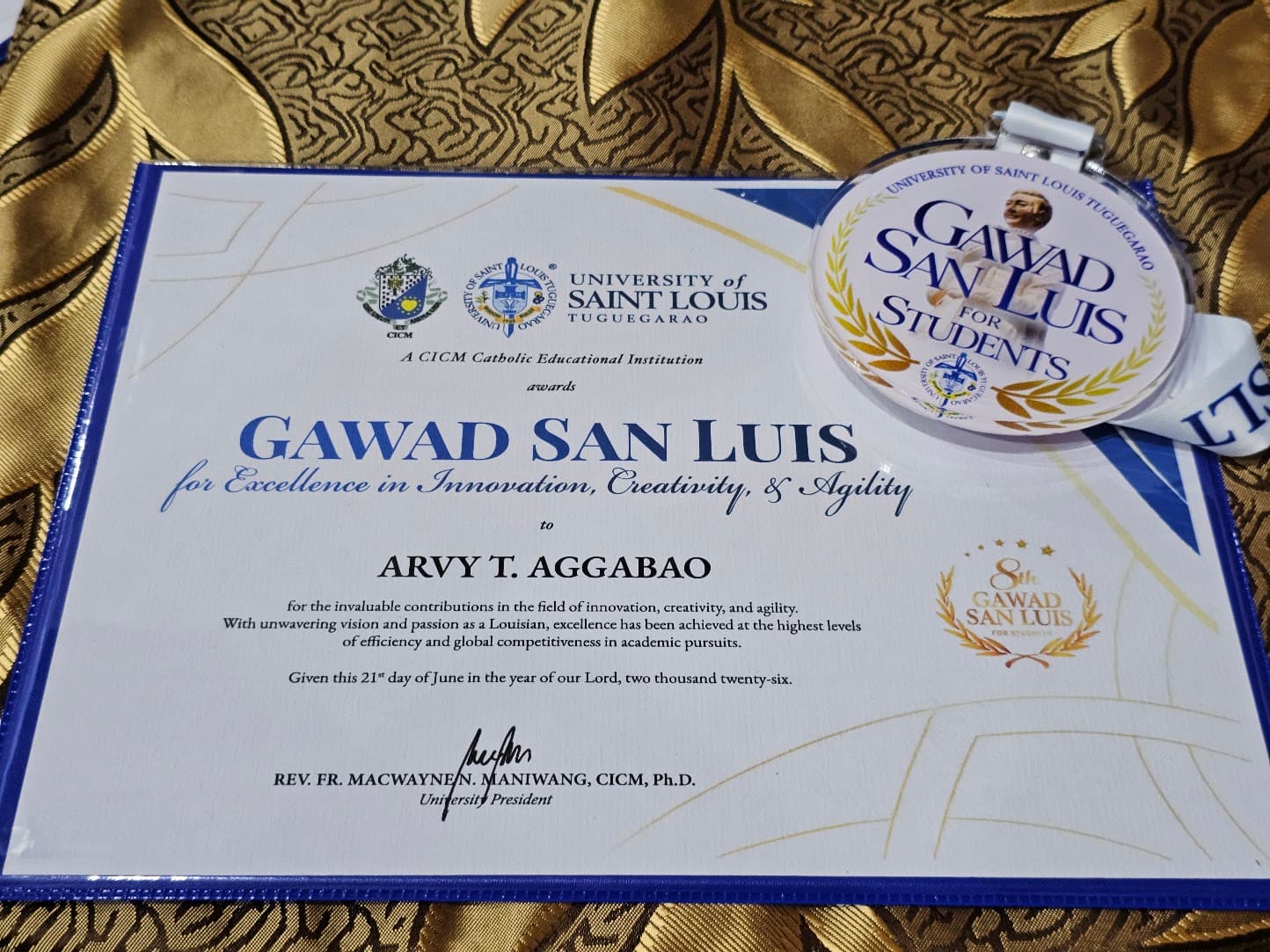 Gawad San Luis for Excellence in Innovation, Creativity, and Agility certificate and medal from the University of Saint Louis Tuguegarao